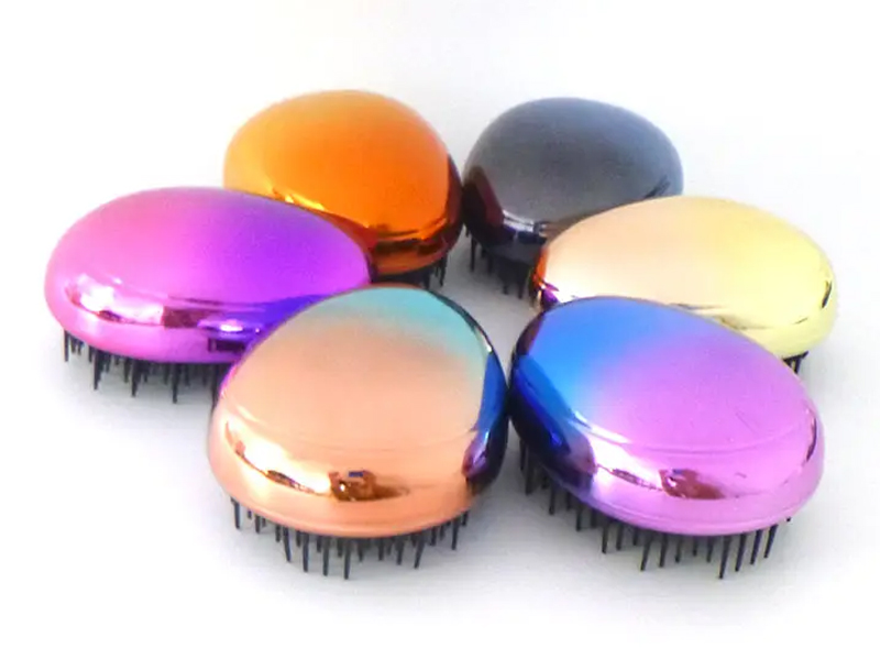 Mini brosse à cheveux démêlante galvanisée en forme d'œuf