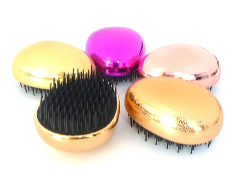 Mini brosse à cheveux démêlante de voyage en forme d'œuf