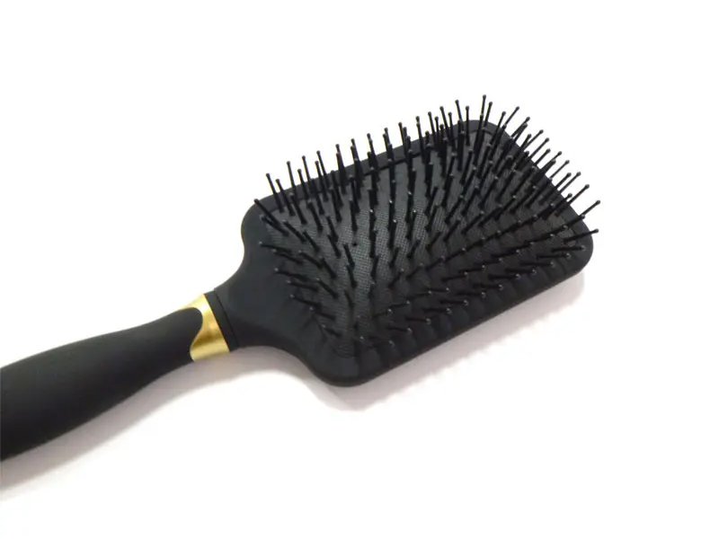 Brosse à cheveux démêlante avec revêtement en caoutchouc