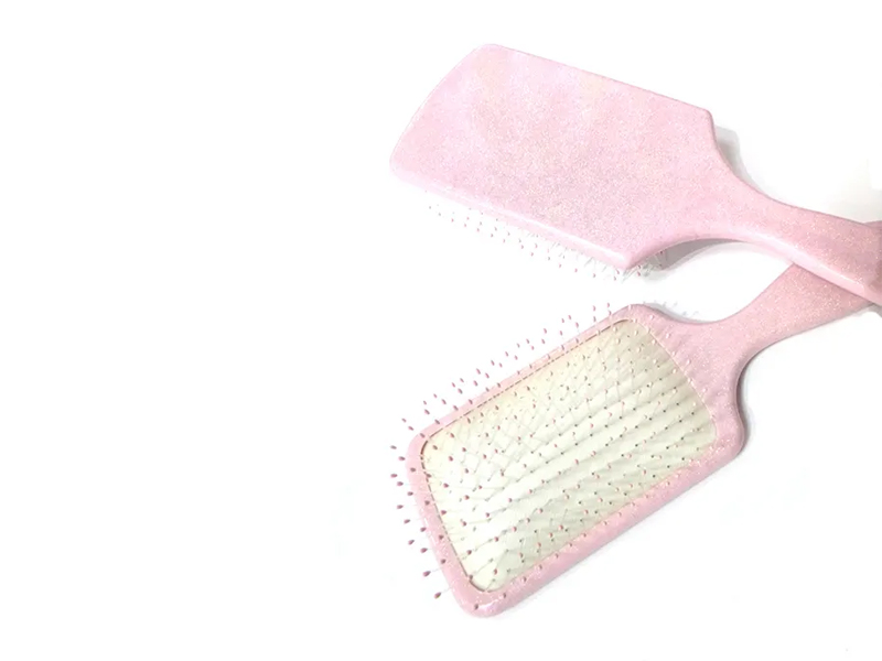 Brosse à cheveux fantaisie en plastique rose