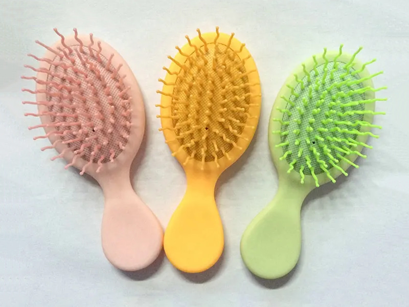 Mini brosse à cheveux colorée démêlante pour enfants