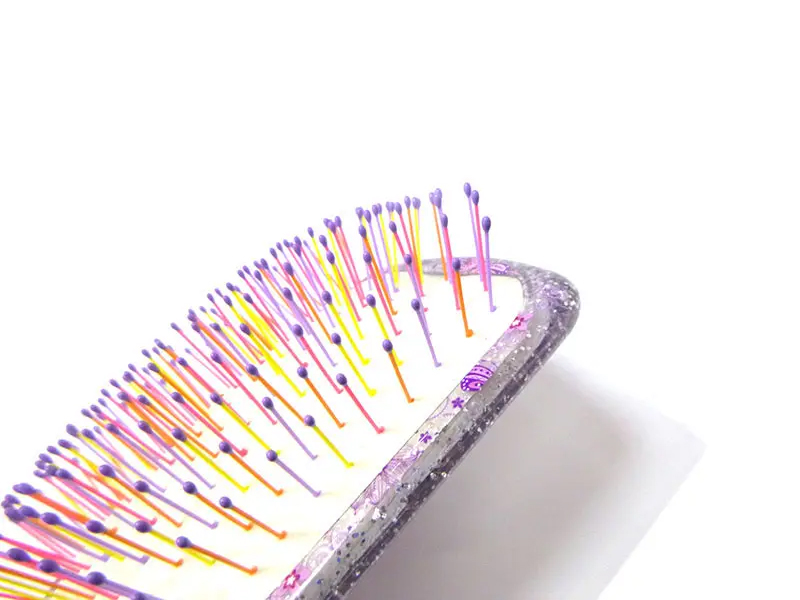 Mini brosse à cheveux démêlante en plastique doux au toucher