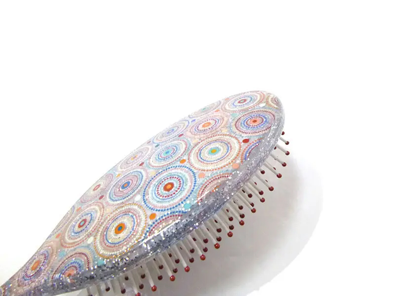 Mini brosse à cheveux démêlante en plastique doux au toucher