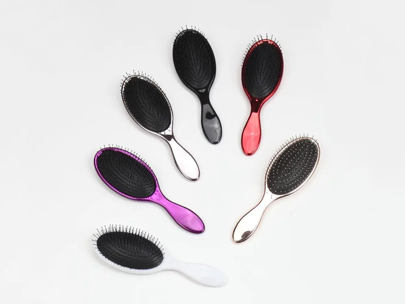 Brosse à cheveux à coussin démêlant en plastique à poils
