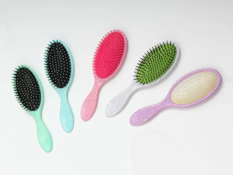Brosse à cheveux à coussin démêlant en plastique à poils